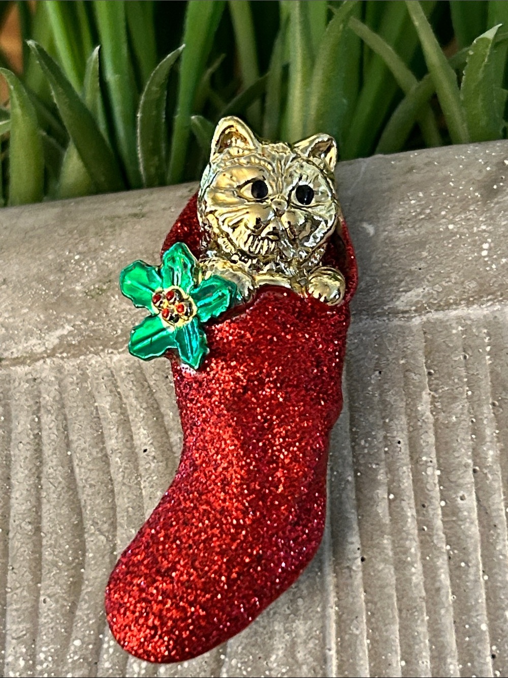 AJC Christmas brooch goldtone cat in a red glittery stocking with green holly